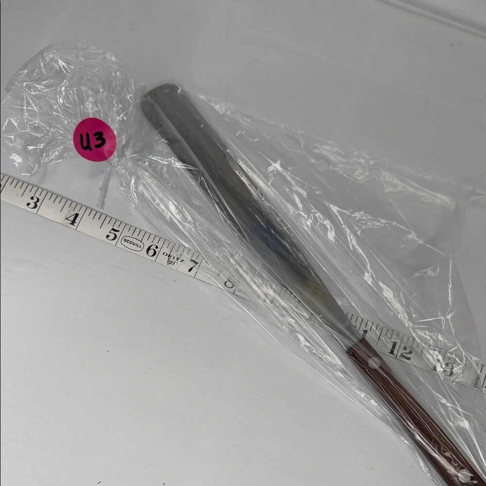 Source Unknown sleek spatula